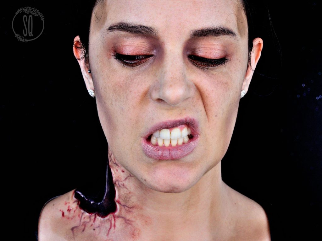 Zombie with part of neck off from a bite makeup tutorial